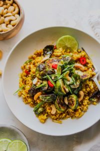 Looking for healthy recipes for your Mardi Gras party? Try this Curried Brown Butter Rice Bowls with Crispy Sprouts by Dishing Out Health, plus 17 other dietitian-approved festive dishes!