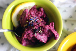 Looking for healthy recipes for your Mardi Gras party? Try this Wild Blueberry Lemon Nice Cream with Edible Flowers by Amy Gorin Nutrition, plus 17 other dietitian-approved festive dishes!